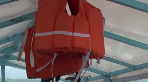 Life jackets blowing in the breeze on a motorised Banca on Lake Taal Stock Footage 51944997