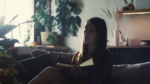 Life on lockdown. Beautiful calm young woman using planner notepad taking notes Video stock 172117055