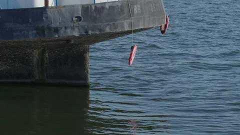Life saving belts hung on old river Danube barge 4K slomo video Stock Footage 205743104