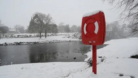 Life saving buoyancy ring by river wharfe and bolton priory yorkshire uk Stock Footage 88988057