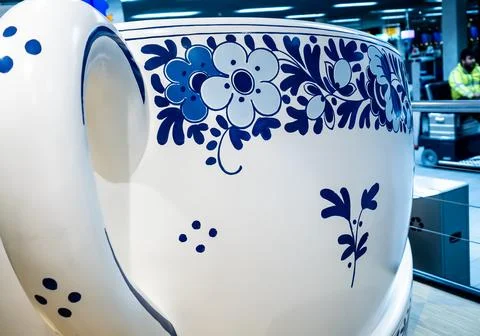 Life-size ceramic Tea Cup showcased in Traditional Delft Blue Pottery Stock Photos