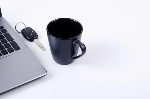 Life technology concept with coffee cups and car key labtop computer on whi.. Stock Photos