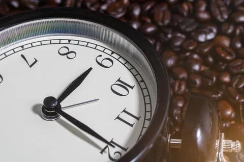 Life time concept close-up clock is on the coffee beans Stock Photos