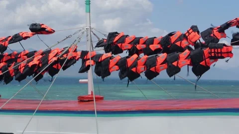 Life vests hang to dry on native tropical boat in Palawan Philippines in summer Stock Footage 154623369