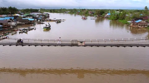 Life on the Water, Bridge Access to School and Community in Banjarmasin Stock Footage 320454833