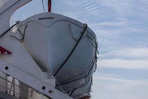 Lifeboat on a large ship while sailing by sea Foto stock