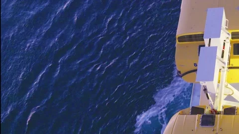 Lifeboats aboard a ship navigating the deep blue ocean maritime safety Stock Footage 317386292