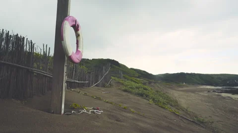 Lifebuoy at the beach Stock Footage 64115813