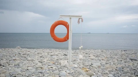 Lifebuoy hanging on the empty beach. 스톡 동영상 78487305