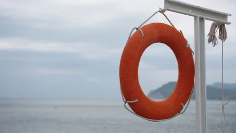 Lifebuoy hanging on the empty beach. Stock Footage 78487415