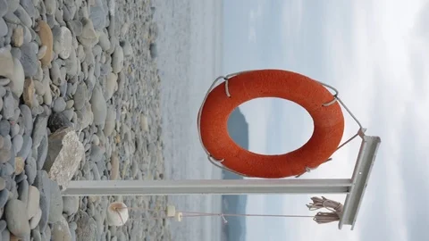 Lifebuoy hanging on the empty beach. Stock Footage 78487441