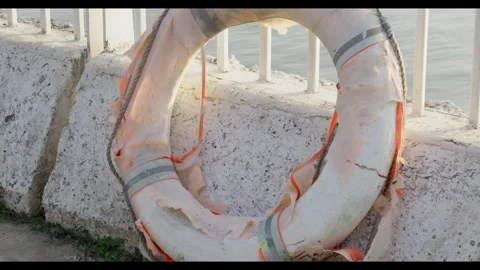 Lifebuoy with Plastic Flapping in Wind for Mindfulness Background Use Stock Footage 327796553