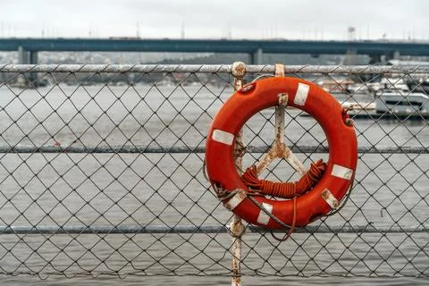 Lifebuoy Ring Attached to Ship Deck Safety Net Stock Photos