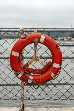 Lifebuoy Ring Attached to Ship Deck Safety Net Stock Photos
