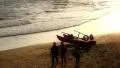 Lifeguard boat and teenager on the beach at sunset HD Footage