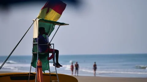 Lifeguard on an Indian beach on a tower Stock Footage 265232686