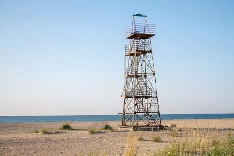 Lifeguard observation tower stands on the beach of the sea Stock Photos