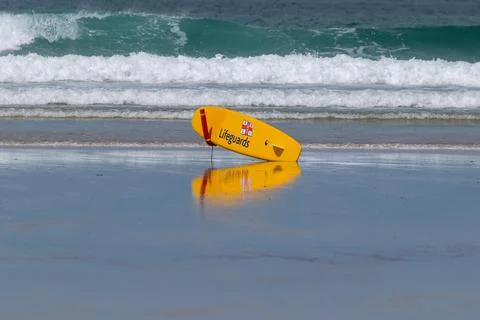 Lifeguard Paddleboard with reflection Stock Photos