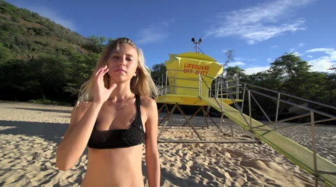  lifeguard posing in front of her life guard tower 스톡 동영상 43967261