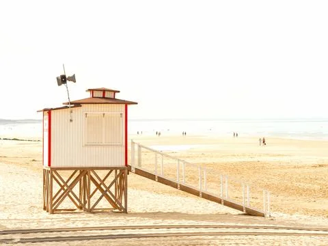Lifeguard post on the beach at sunset Stock Photos