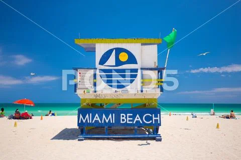 Lifeguard tower with colorful cloud and blue sky. Miami Beach. Florida. USA. Stock Photos