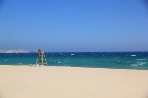 Lifeguard tower on the empty beach Stock Photos