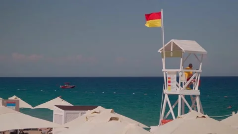 Lifeguard on the watchtower Stock Footage