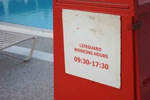 Lifeguard working hours by the pool area Stock Photos