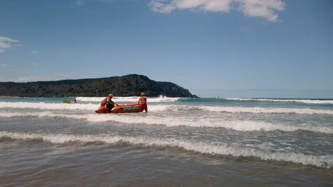 Lifeguards launching an IRB in the surf Stock-Footage 127679790
