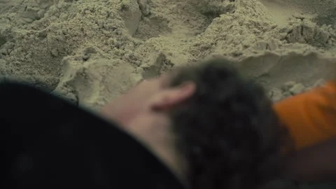 Lifeguards performing CPR on the beach Stock Footage 263934073