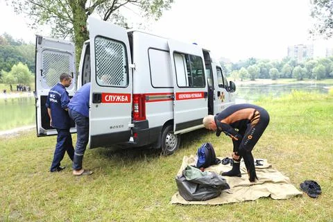 Lifeguards preparing diving equipment in front of rescue mobile post. Kiev,Uk Stock Photos