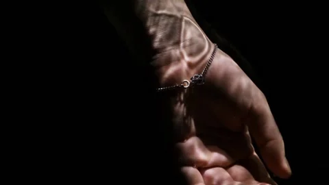 Lifeless hand floating under water on a black background. Видео 221767286
