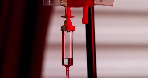 Lifesaving Rhythms: Slow Motion IV Drip Silhouetted by Ambulance Lights Stock Footage 261596533