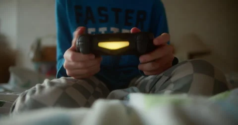 Lifestyle Concept of Child Playing Electronic Games at Home Stock Footage 331657983