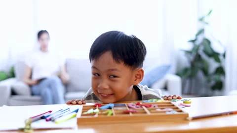 Lifestyle naughty hyperactive boy playing and looking to camera wtihe color.. Video stock 246312097