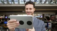 Lifestyle Portrait Of Young Attractive Business Man Using Digital Tablet Device Stock Footage
