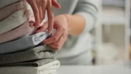 Lifestyle, Store Worker Relaxed Counting Towels, Running Fingers Over Stacke Stock Footage