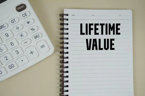 Lifetime Value text with calculator phrase of business and financial concept Stock Photos