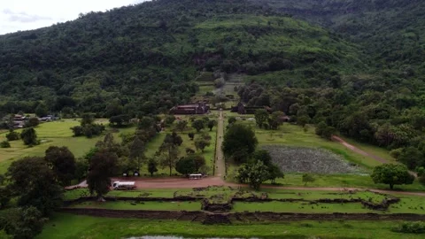 Lifing up flying view of the outer lower parts of ancient temple structure. Video stock 330062091