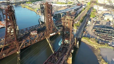 Lift bridge span and tidal channel beside Jersey City yards 動画素材 130305628