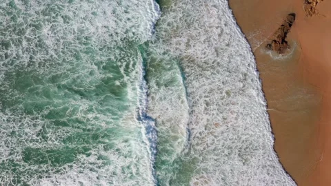 Lift d rone flying high above the shore with blue waves of amazing beauty and Stock Footage 255408718
