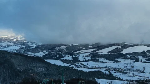 Lift in a dramatic sky in the mountains time lapse Video stock 97895312