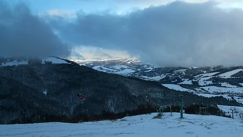Lift in a dramatic sky in the mountains time lapse Stock-Footage 98211542