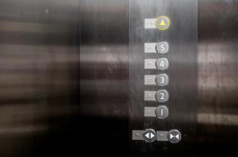 Lift or Elevator buttons and wall inside.Accessible elevator push buttons. Fotos de archivo
