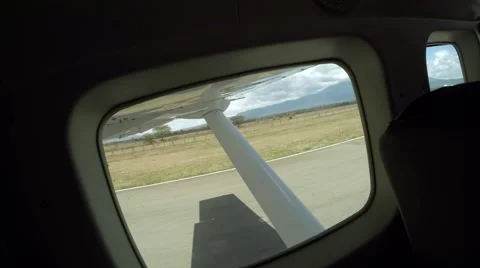 Lift off of a small plane in Arusha Stock Footage 60389774