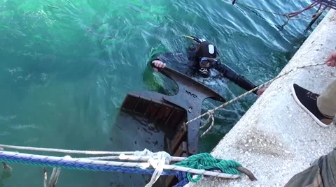 Lifting a bench from the sea- Stock Footage 48865953