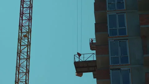 Lifting bricks construction of new modern skyscraper or living building in city Stock Footage 339531665