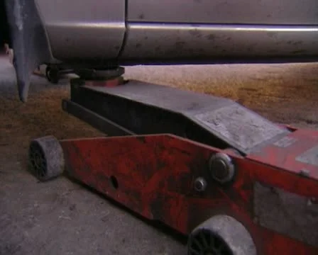 Lifting a car with a jack 스톡 동영상 20510898
