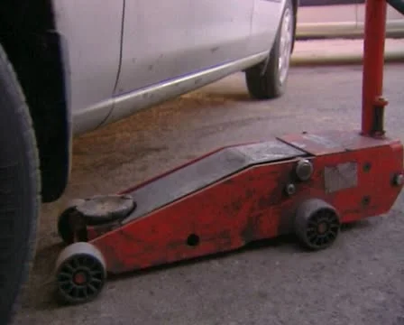 Lifting a car with a jack Stock Footage 20510900