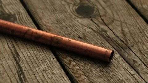 Lifting a Copper Pipe with Pliers Stock Footage 73437041